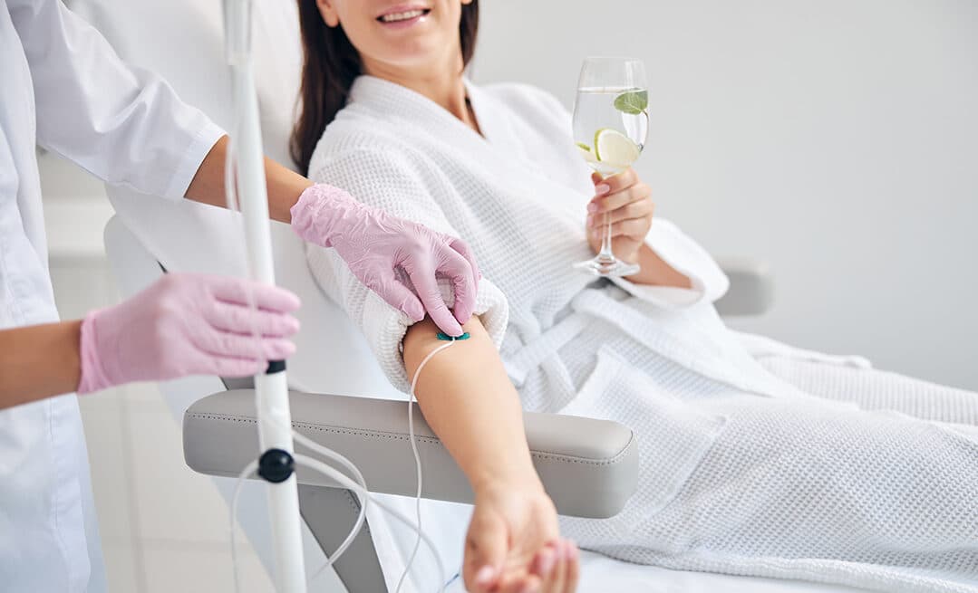 An IV drip therapy session being administered by a doctor at The Aesthetic Edge