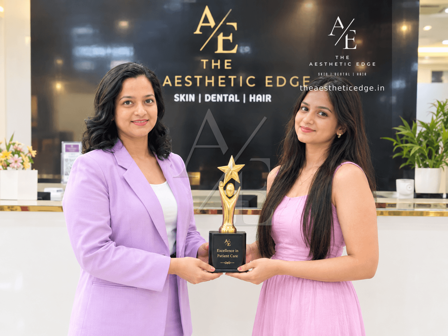 A member of The Aesthetic Edge team being presented with the clinic's Excellence in Patient Care award at reception