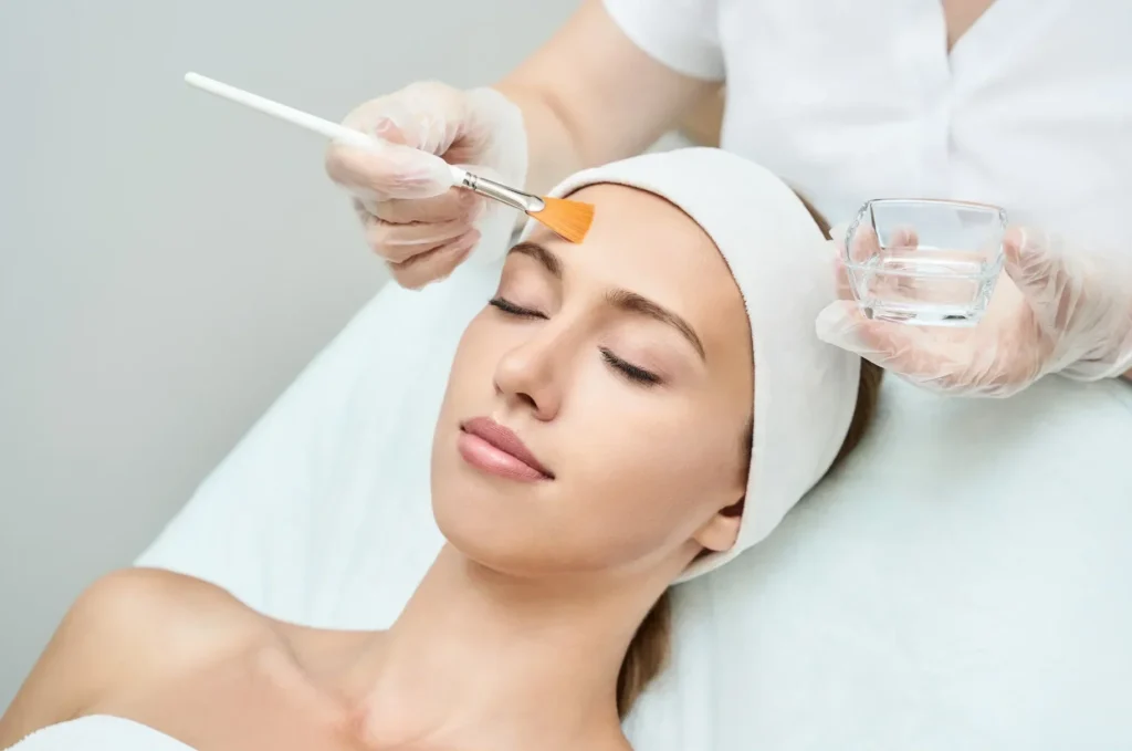 Doctor performing a skin treatment at The Aesthetic Edge